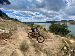 woman mountain biking on mcphee overlook trail in dolores colorado