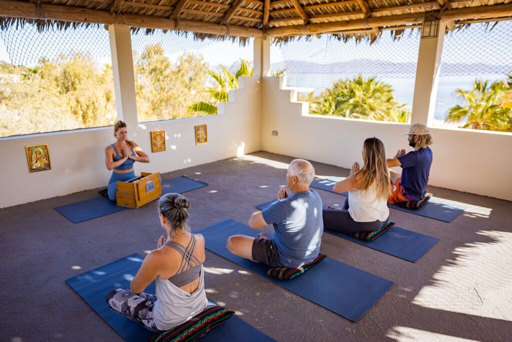 a yoga class in la ventana mexico with a beach view