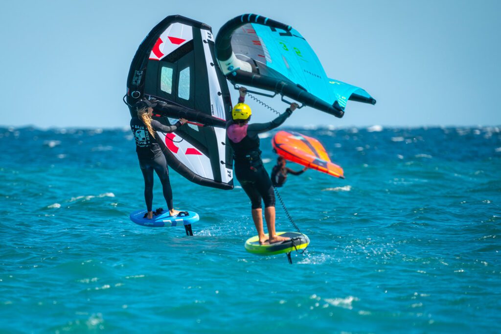 Student following instructor on a wing foiling lesson in La Ventana