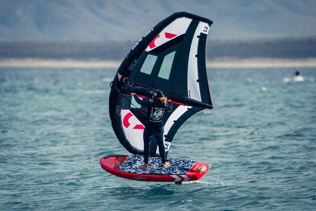 Instructor demonstrating wing foiling in La Ventana, Baja